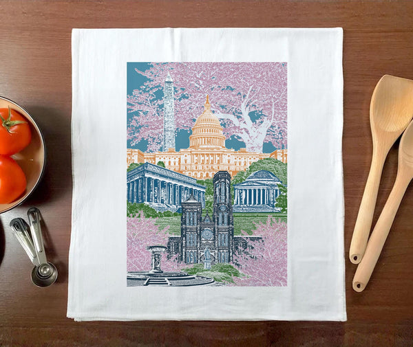 This is a tea towel with an montage of Washington DC buildings on it with cherry blossoms.